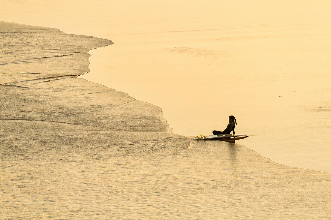 Surfer On Empty Beach,Byron Bay,New South Wales,Australia