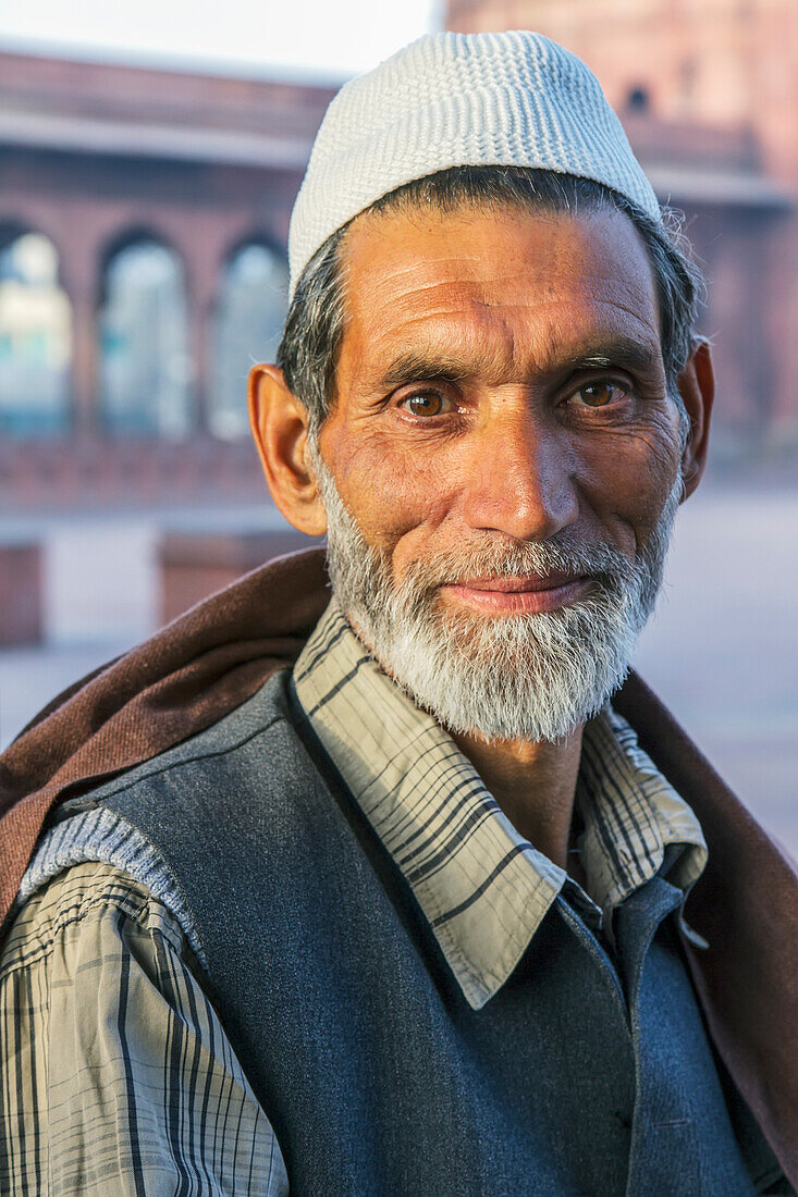 India,Delhi,Portrait of Muslim man with Kashmir at Jama Masjid in background,New Delhi