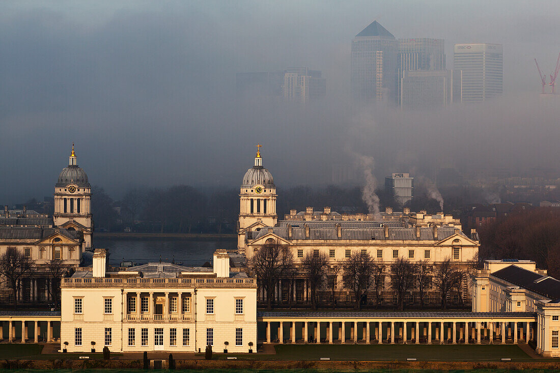 Old Royal Naval College And Canary Wharf On Foggy Winter Morning Seen From Greenwich Park,Greenwich,London,England,Uk