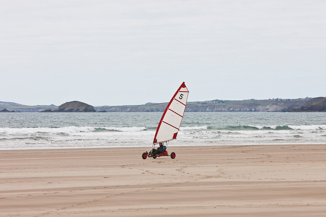 Wind Yacht Speeding On Sand On Newgale Beach Along Pembrokeshire Coast Path Near St David's,Wales,Uk