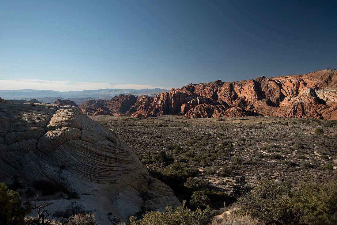 Hiking trail through Snow Canyon,behind the Red Mountain Spa,with Snow Canyon Mountain Range in the background at Red Cliffs Desert Reserve around St George Town,St George,Utah,United States of America