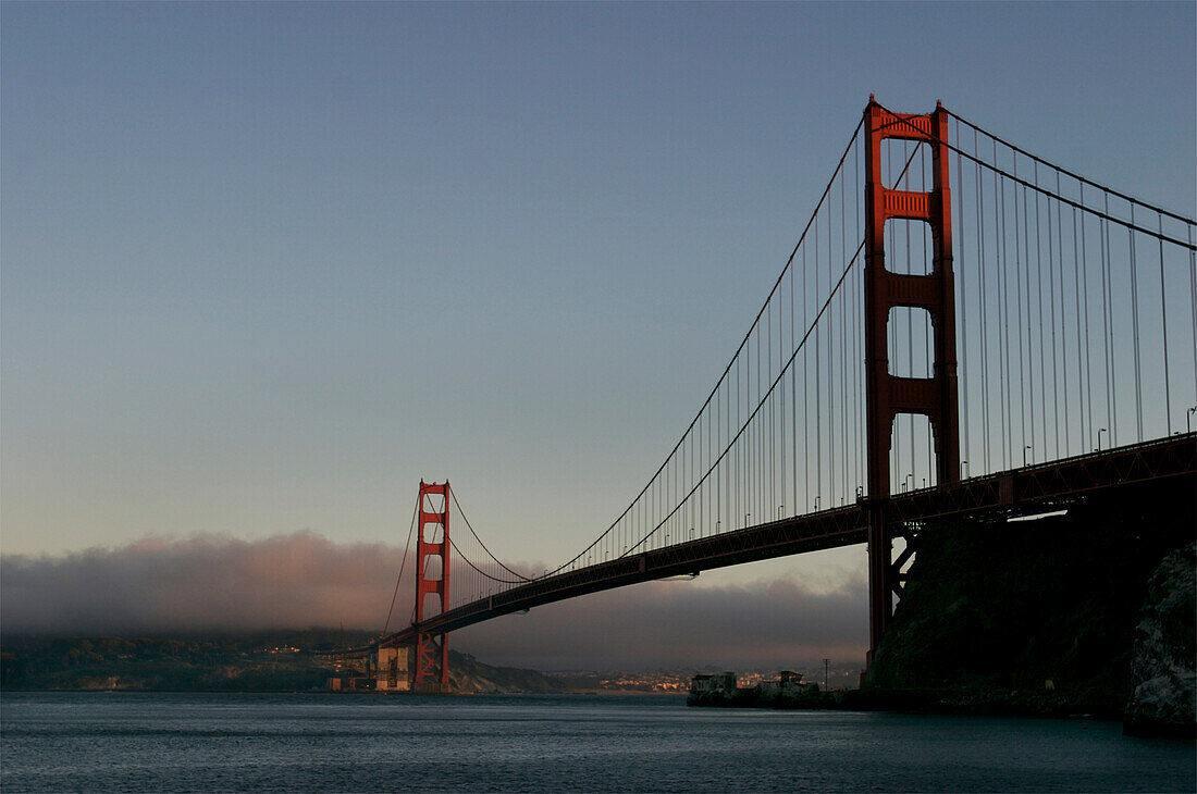 Golden Gate Bridge at sunset with fog over San Francisco in California,USA,San Francisco,California,United States of America