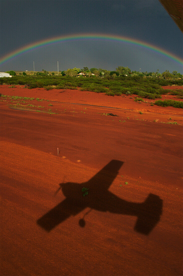 Rainbow and shadow of an airplane in the Kimberley Region of Western Australia,Halls Creek,Kimberley Region,Western Australia,Australia