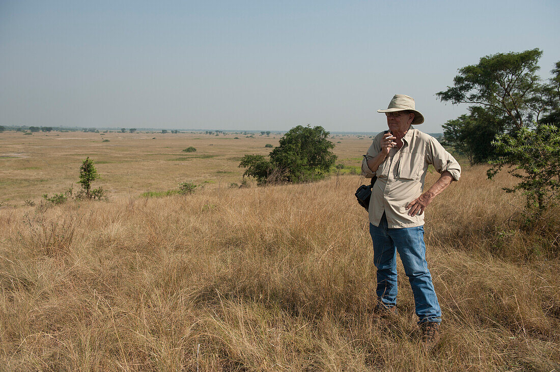 Man admires the scenery in Queen Elizabeth National Park,Uganda