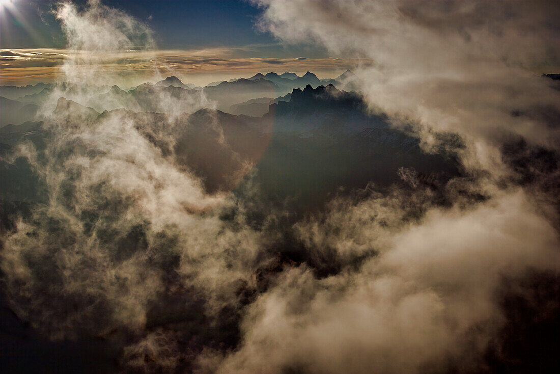 Aerial view of morning fog rising from the Dolomite Mountains,Ortisei,Italy