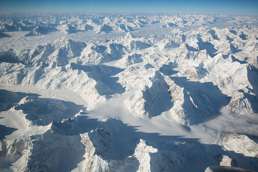 View of the rugged peaks of the Himalaya mountains from an airplane en route into Tibet from the south,Tibet