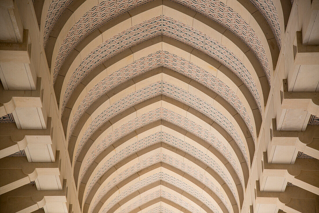 Low angle view of the patterned arched ceiling inside the Sultan Qaboos Grand Mosque,Muscat,Oman