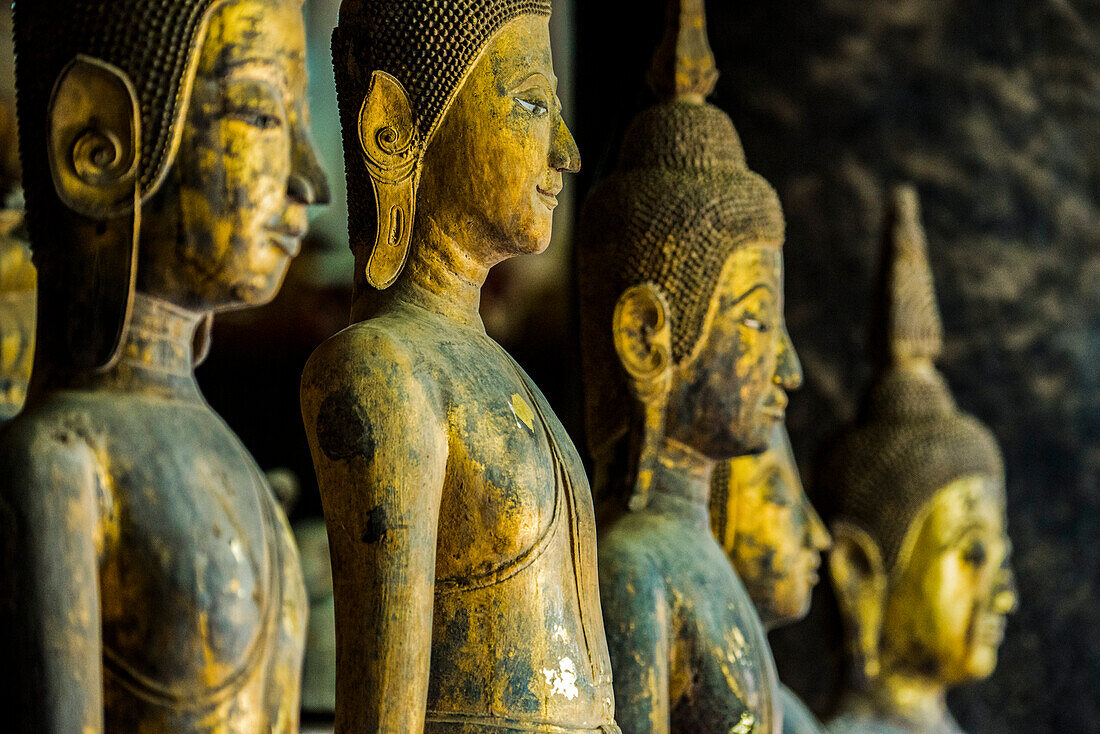Row of standing Buddha images at Wat Visoun,commonly known as That Makmo,Luang Prabang,Laos