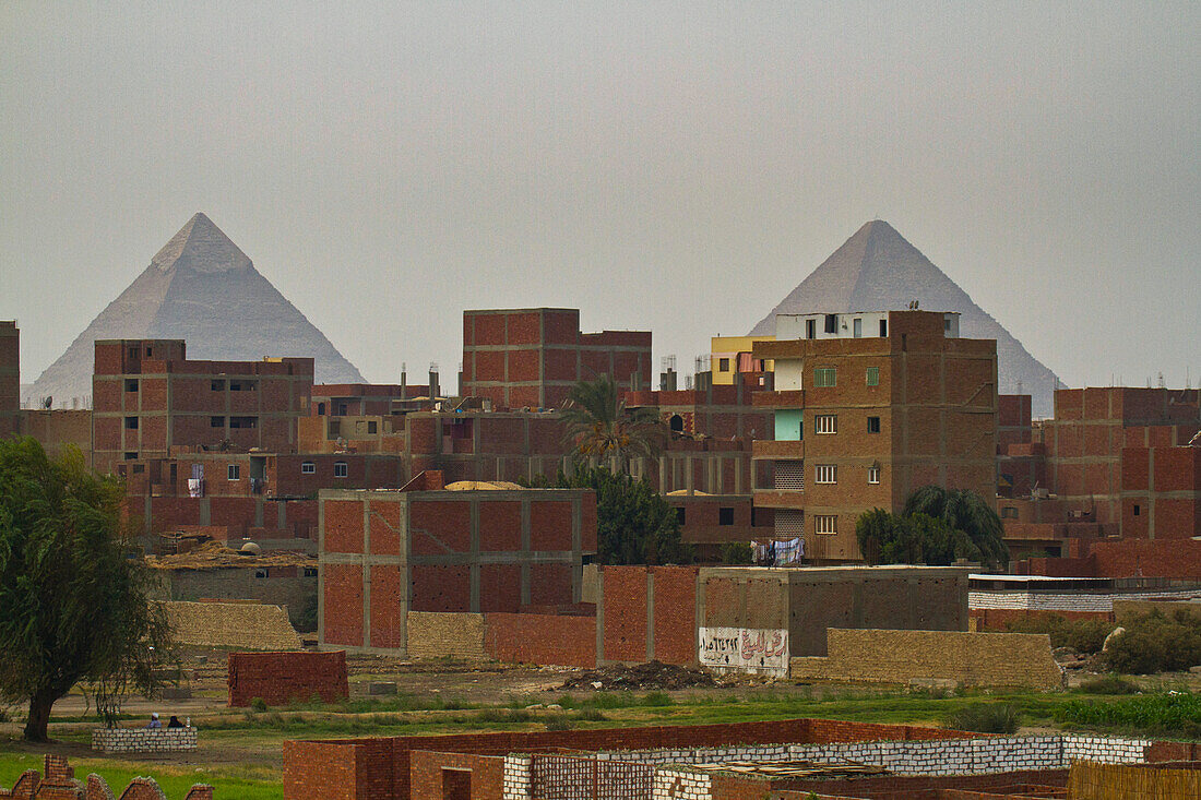 Pyramids behind the town of Giza,Giza,Egypt