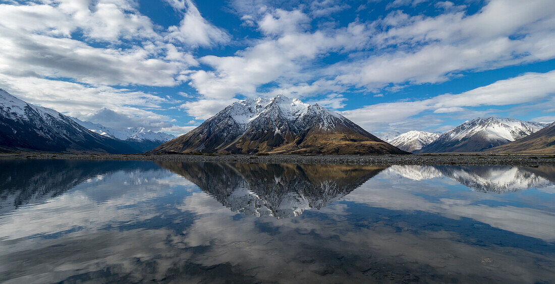 Mount Glen Lyon and clouds reflect in a pool off the Hopkins River,Twizel,South Island,New Zealand