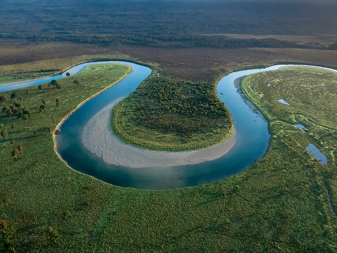 Aerial view of a river bend in Mount Aspiring National Park at sunrise,Haast,South Island,New Zealand