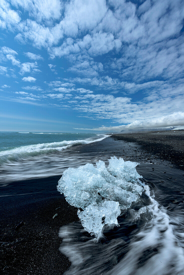 Small iceberg from Vatnajokull on the shore of a black sand beach,Iceland