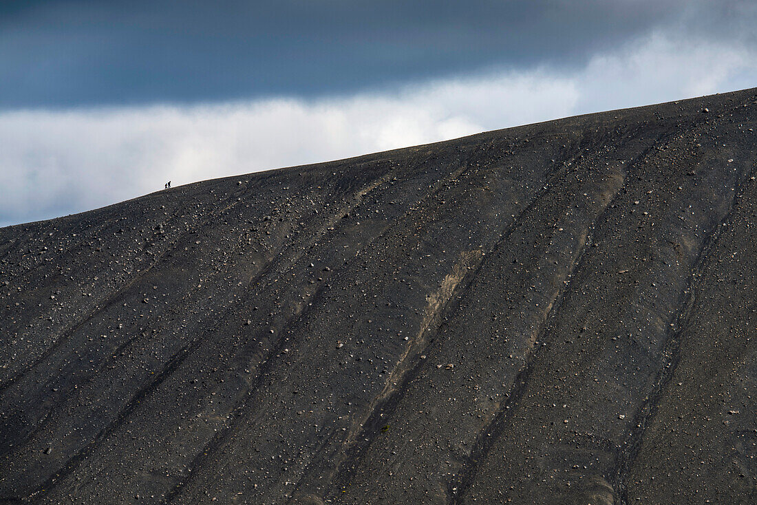 Two hikers on the top of a crater in Hverfjall,Iceland,Iceland