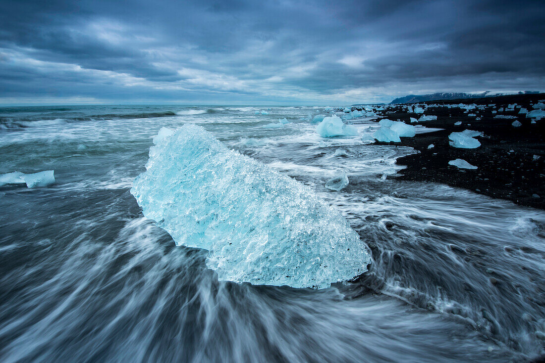 Iceberg from Jokulsarlon lagoon on a black sand beach,Iceland