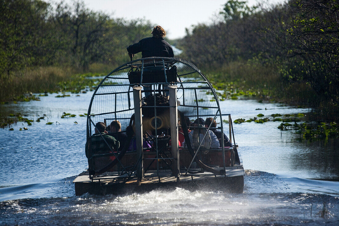 Tourists on an airboat ride in Everglades National Park,Florida,Florida,United States of America