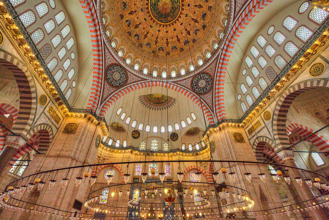 Interior of the Suleymaniye Mosque,view of domed ceiling and light fixtures,built beginning in 1550,Unesco World Heritage Site,Istanbul,Turkey