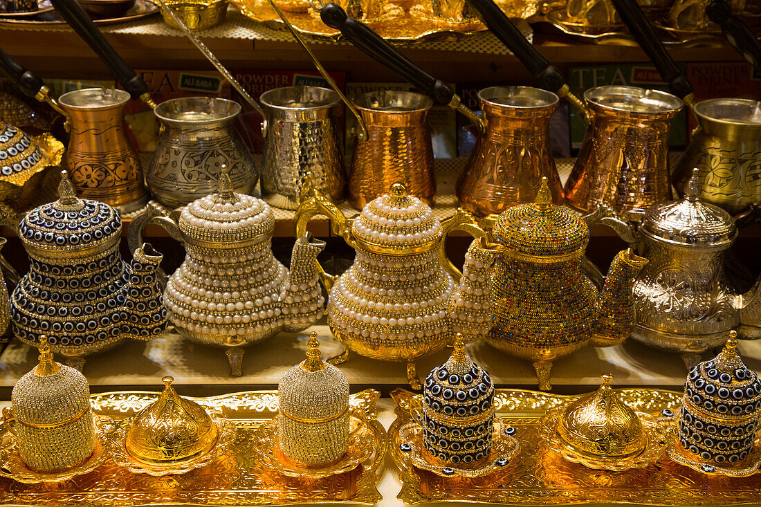 Decorative teapots for sale,brass,copper and bedazzeled with gems on display in a shop in the Spice Bazaar in the Fatih District,Istanbul,Turkey