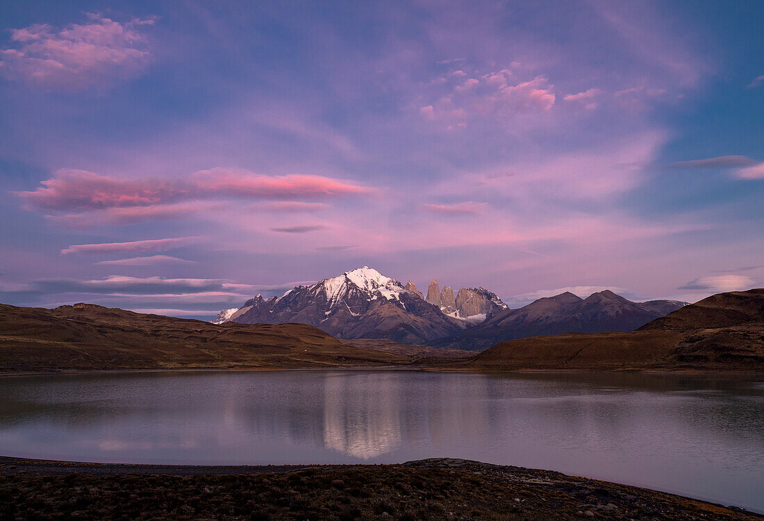 Sunrise on the towers of Paine reflected in Lago Amarga in Torres del Paine National Park,Patagonia,Chile