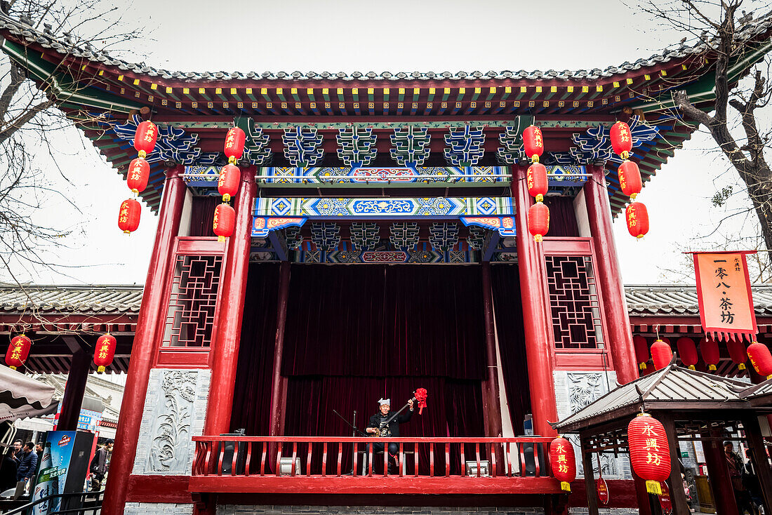 Musician performing on stage at the Northwest Antiques Market,Xian,Shaanxi Province,China