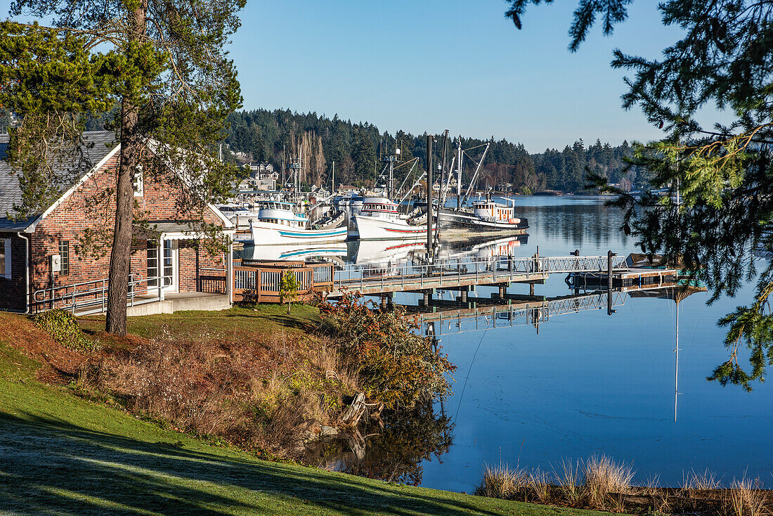 A serene morning view looking across a portion of the the marina and fishing boats at Gig Harbor,Gig Harbor,Washington,United States of America
