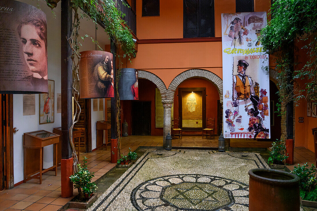 Decorative interior of a Synagoge with artwork displayed and a Star of David on the ground,Jewish Quarter of Cordoba,Cordoba,Spain