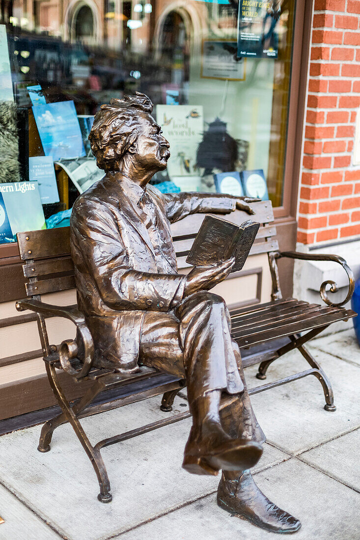 Sculpture of Mark Twain on a bench reading a book outside a bookshop,Fairhaven,Washington,United States of America