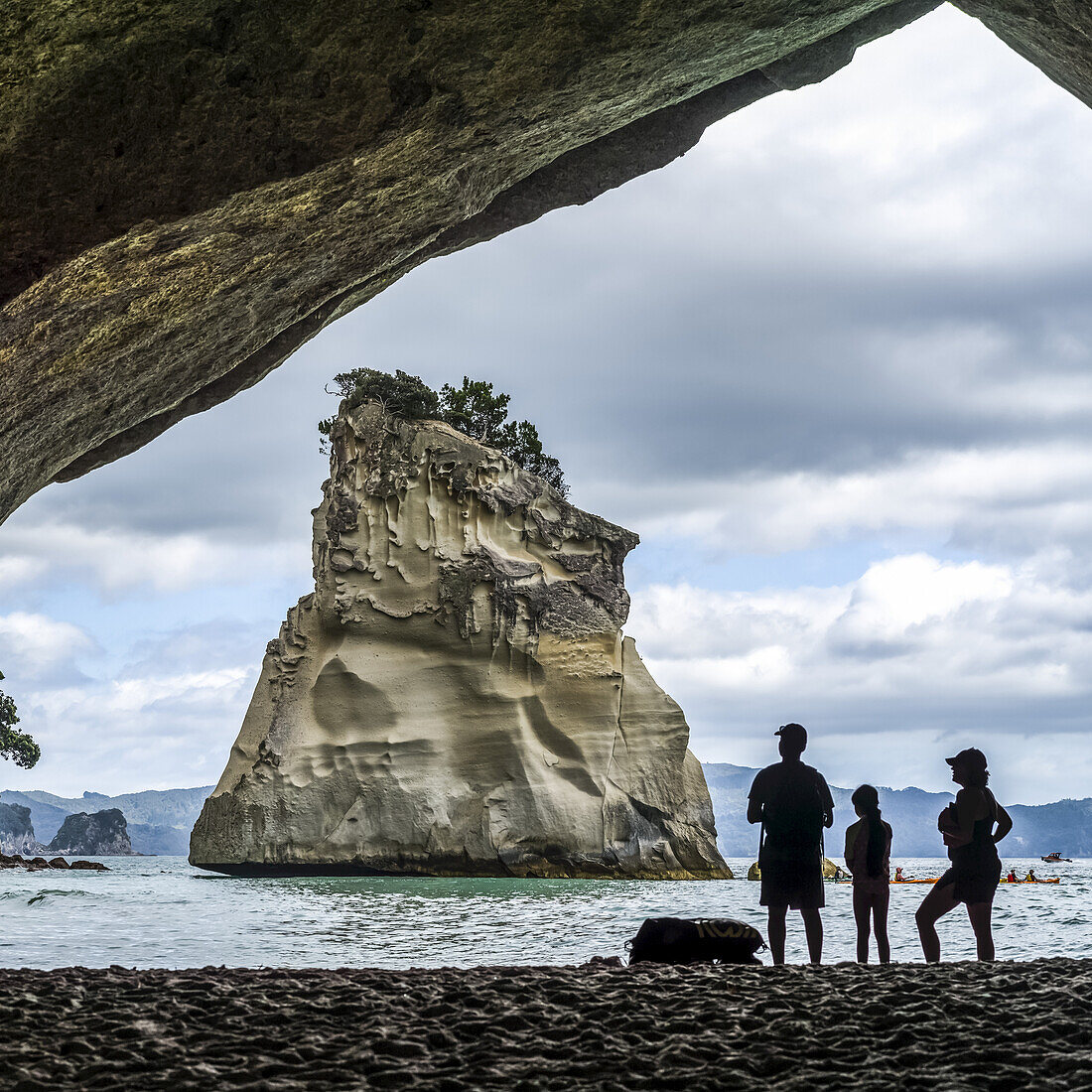 Accessible only on foot or by boat,famous Cathedral Cove is one of the must visit sites on The Coromandel. Swimmers enjoy the beach and playing in the water,Waikato Region,New Zealand