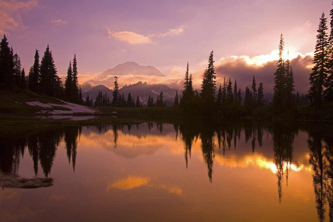 Mirror image of Mount Rainier and forest reflected in Tipsoo Lake at sunrise,Mount Rainier National Park,Washington,United States of America