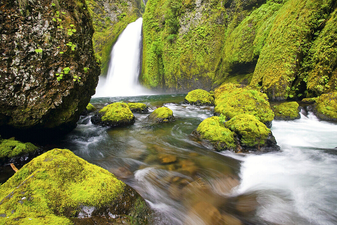 Waterfall and stream along moss-covered rocks in Columbia River Gorge,Oregon,United States of America