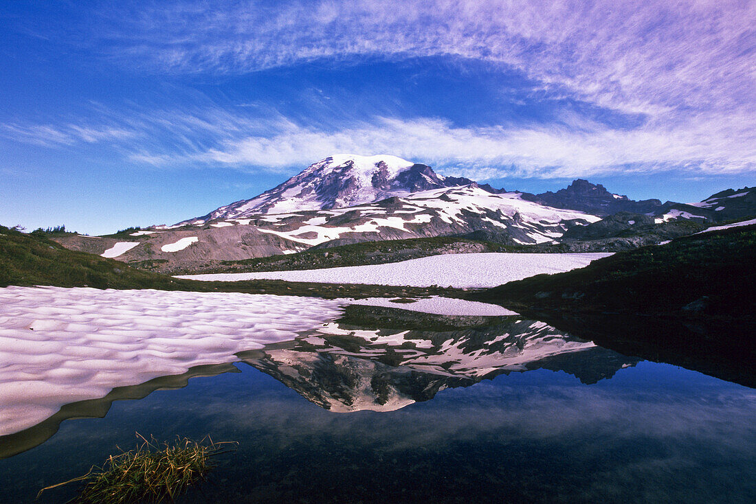 Mount Rainier reflecting in a tranquil pond in Mount Rainier National Park,Washington,United States of America