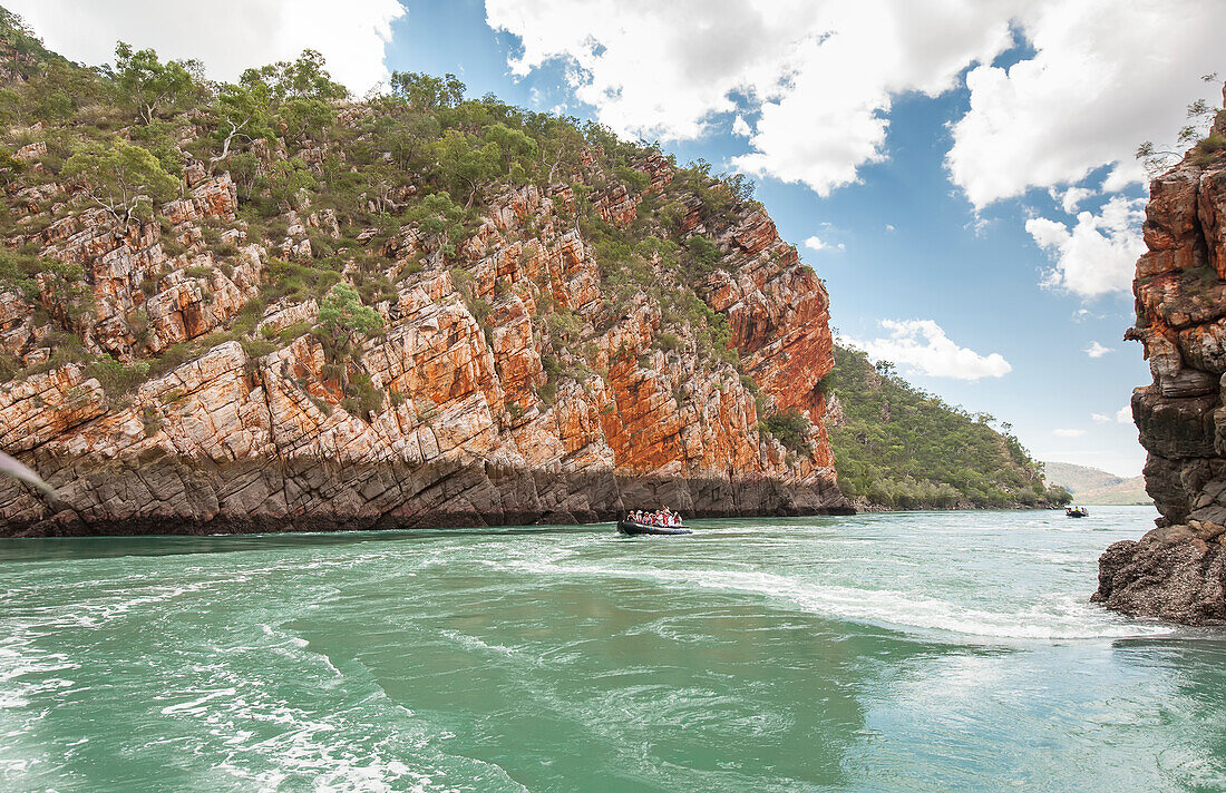 Tourists explore Talbot Bay in inflatable boats in the Kimberley Region of Western Australia,Western Australia,Australia