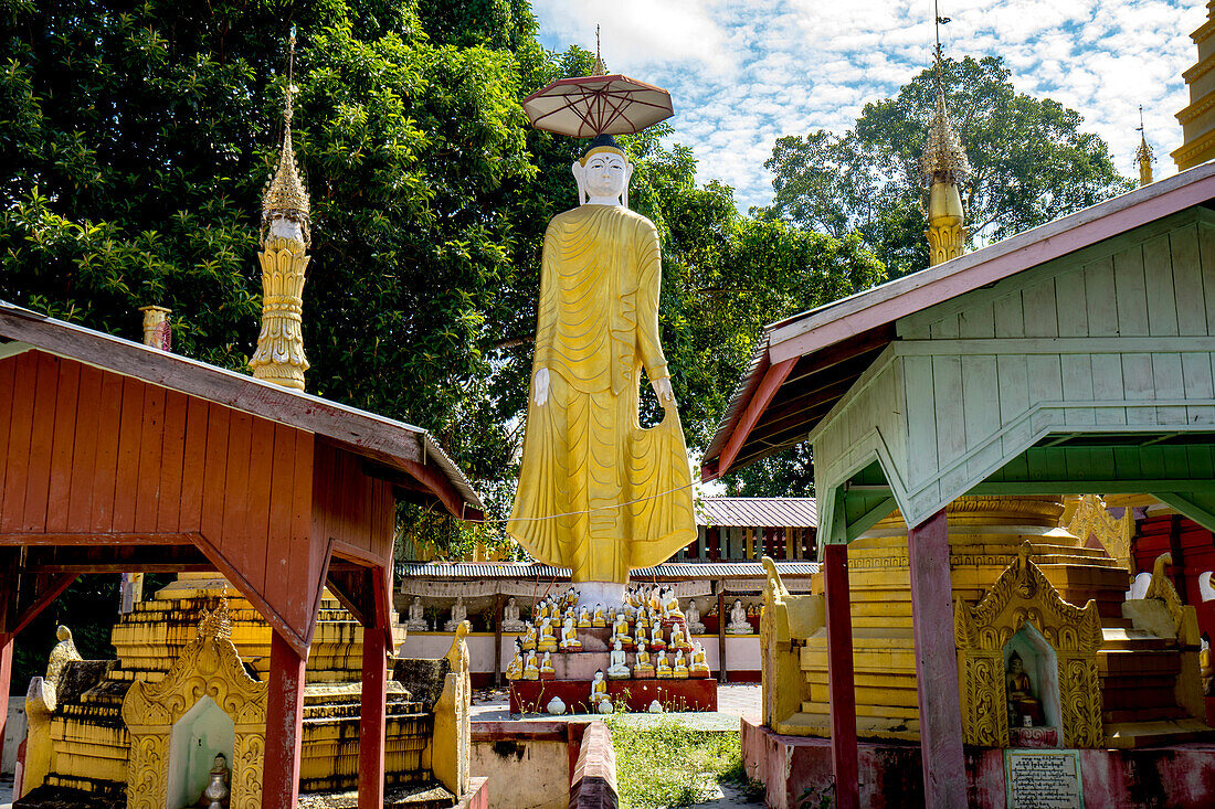 Standing Buddha image in the monastery and pagodas on Shwe Paw Island on Irrawaddy river,Shwegu,Myanmar/Burma,Shwegu,Kachin,Myanmar