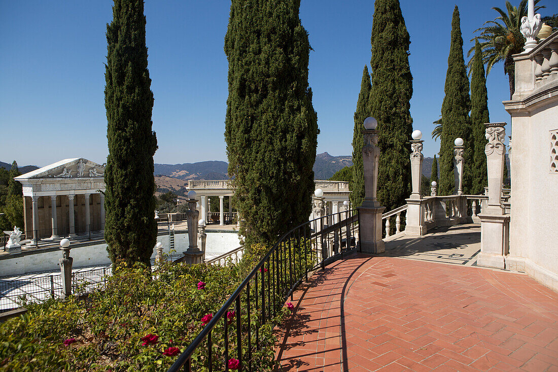 The Neptune Pool and veranda at Hearst Castle are landscaped with trees and plants.,Hearst Castle,San Simeon,California