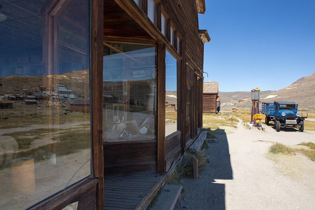 An abandoned general store,gas station,and an antique truck at Bodie Ghost Town.,Bodie State Historic Park,Bridgeport,California