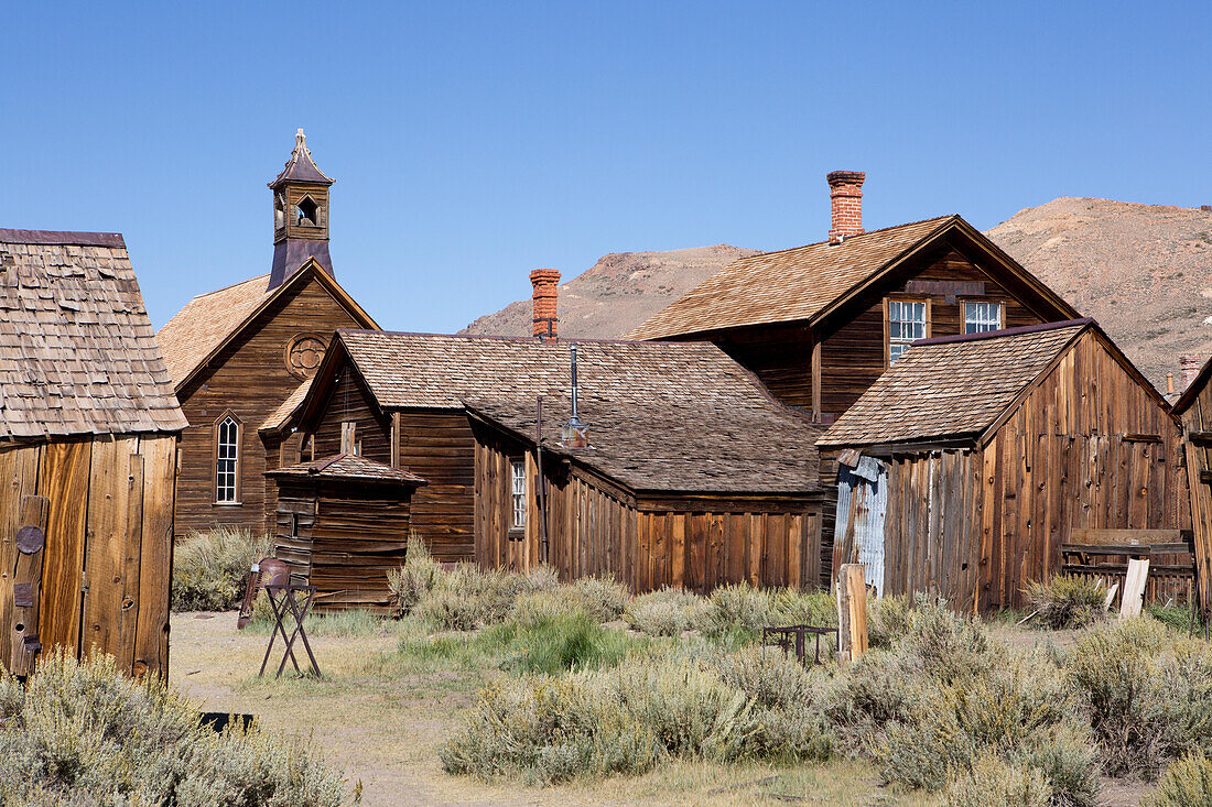 A church and several abandoned homes in Bodie Ghost Town.,Bodie State Historic Park,Bridgeport,California