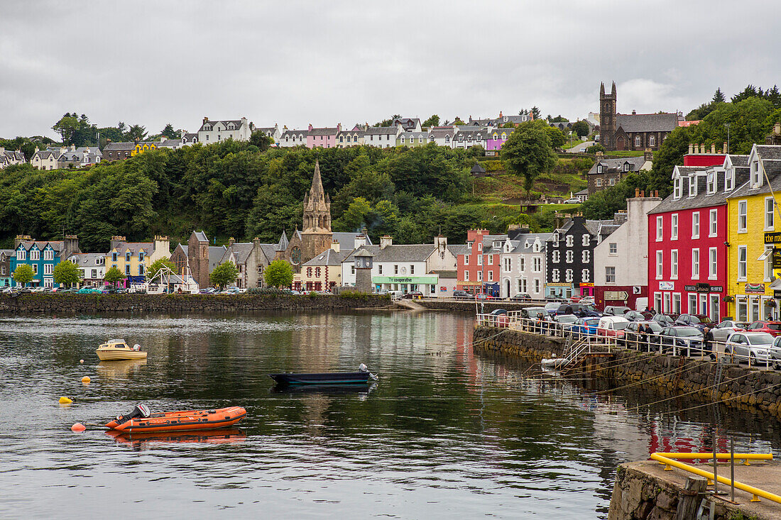 Several small boats float in the harbour of the colourful village of Tobermory,which is located on the Isle of Mull,Scotland,Tobermory,Isle of Mull,Scotland