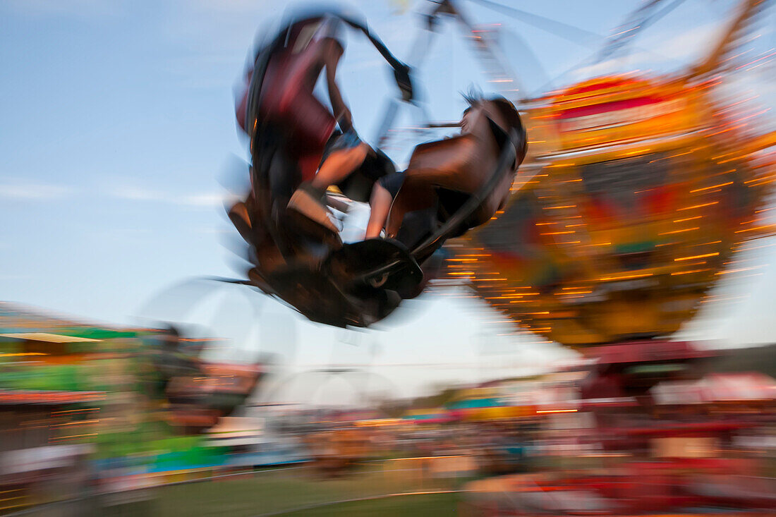 In Rainier,Oregon,a traveling carnival operates and young people enjoy the ride,Rainier,Oregon,United States of America