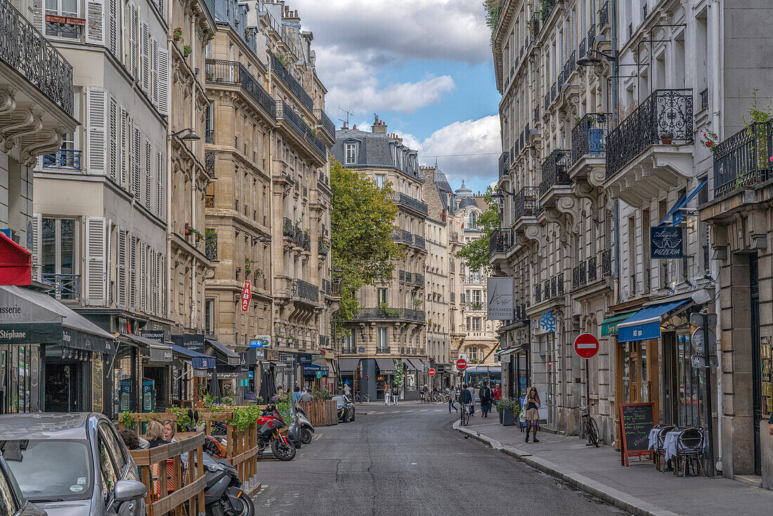 Traditional street in Paris with shops and cafes,Paris,France