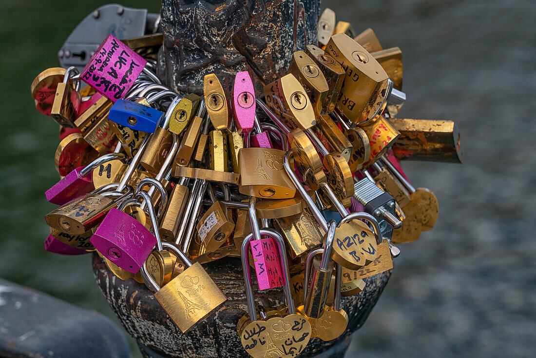 Locks create a piece of art on one of the many bridges across the Seine River,Paris France