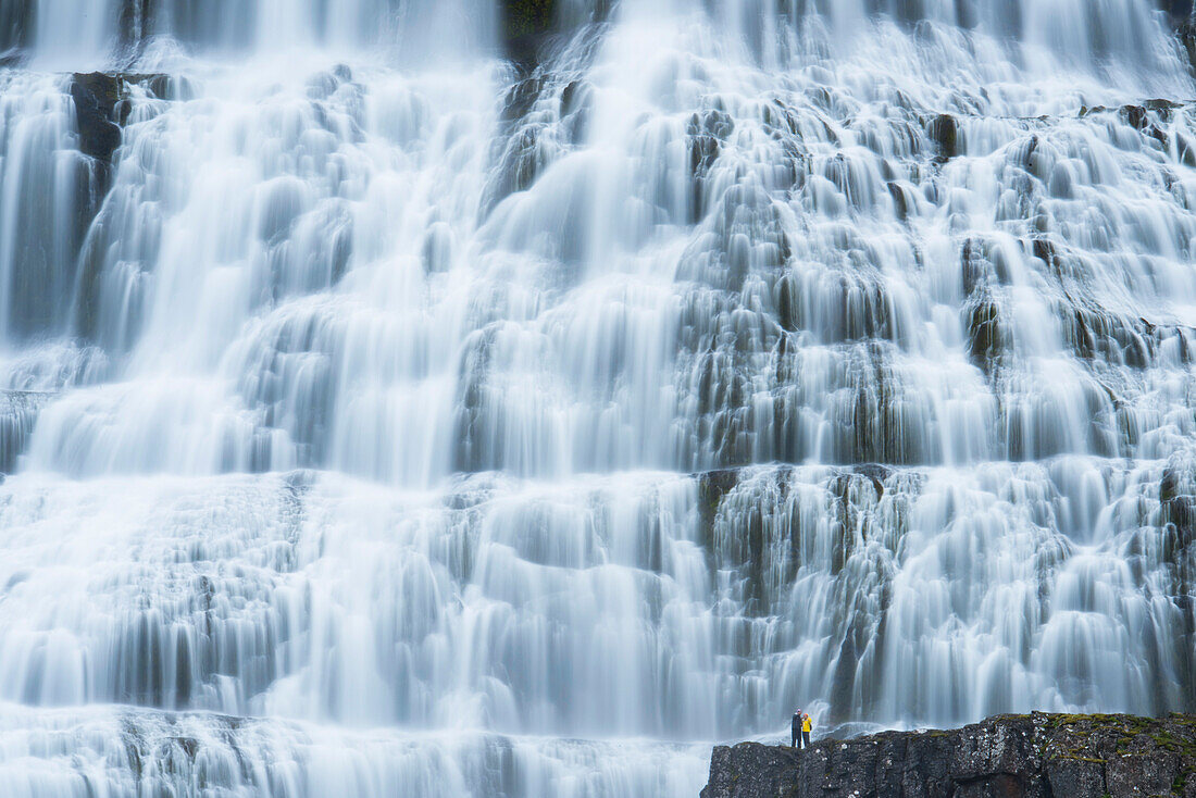 Tourists visit Dynjandi waterfall,also called Fjallfoss,in Westfjords,Iceland,Iceland