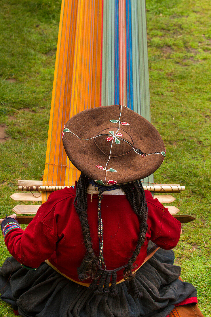 Woman weaves in the tradition of ancient Incas,Cuzco,Peru