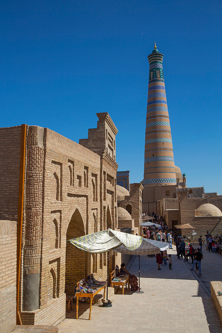 Shopping street and Islamic Khoja Minaret in Itchan Kala,Khiva,Uzbekistan,Khiva,Uzbekistan