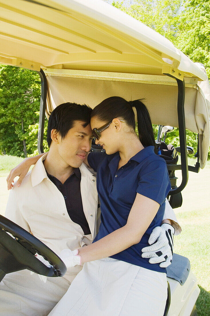 Couple in Golf Cart