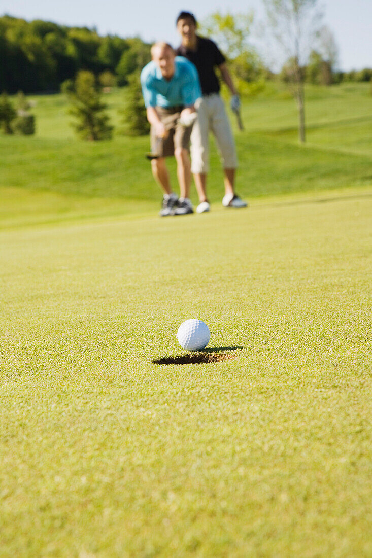 Men Playing Golf