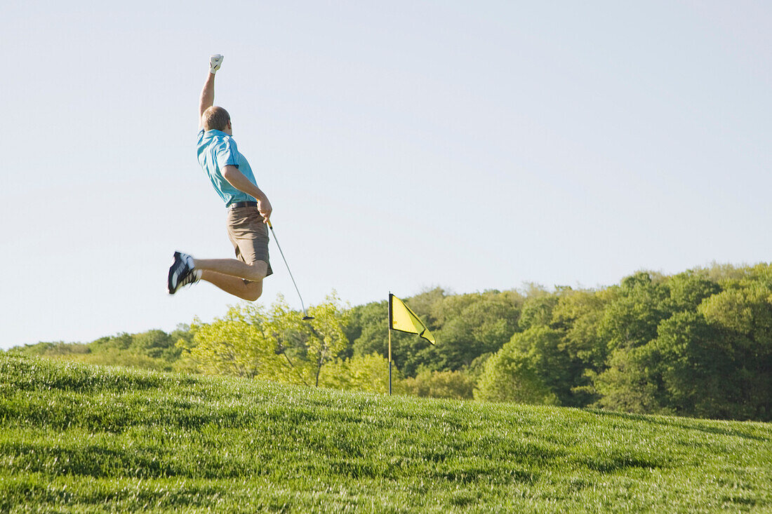 Excited Golfer Jumping