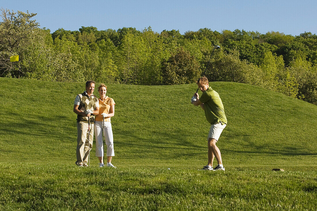 People Golfing