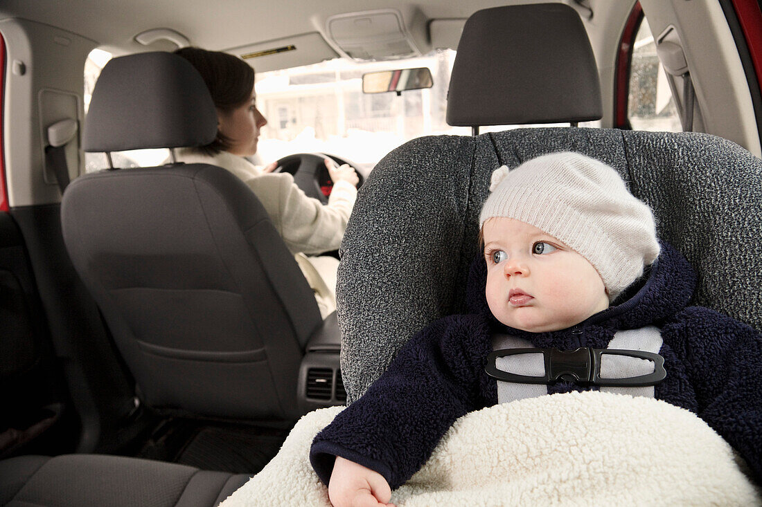 Baby in Car Seat with Mother Driving