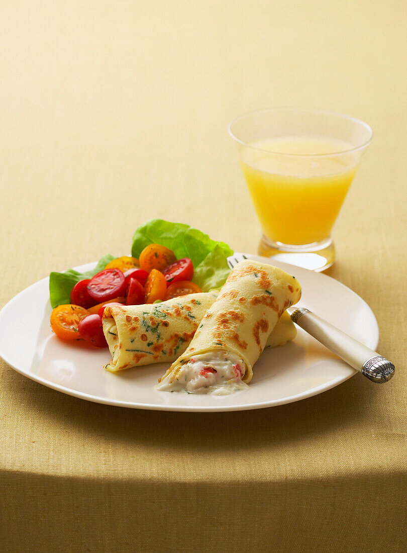 Salmon Crepe on Table with Orange Juice