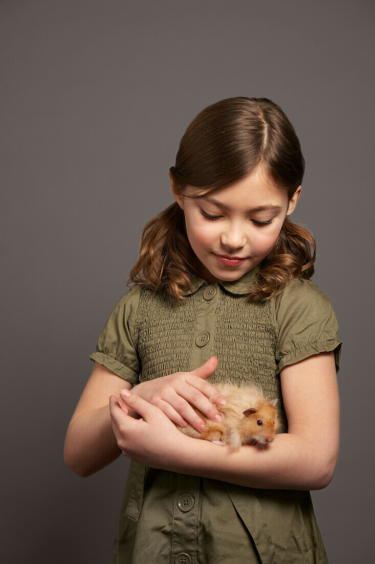 Girl Petting Hamster