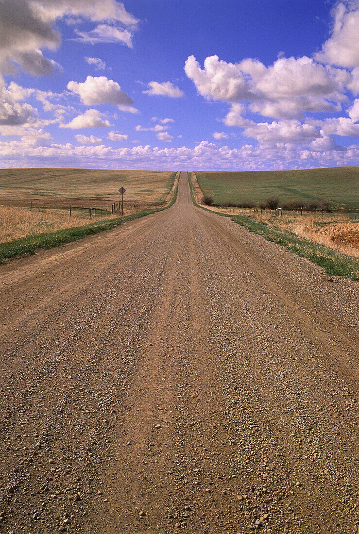 Dirt Road and Clouds in Sky